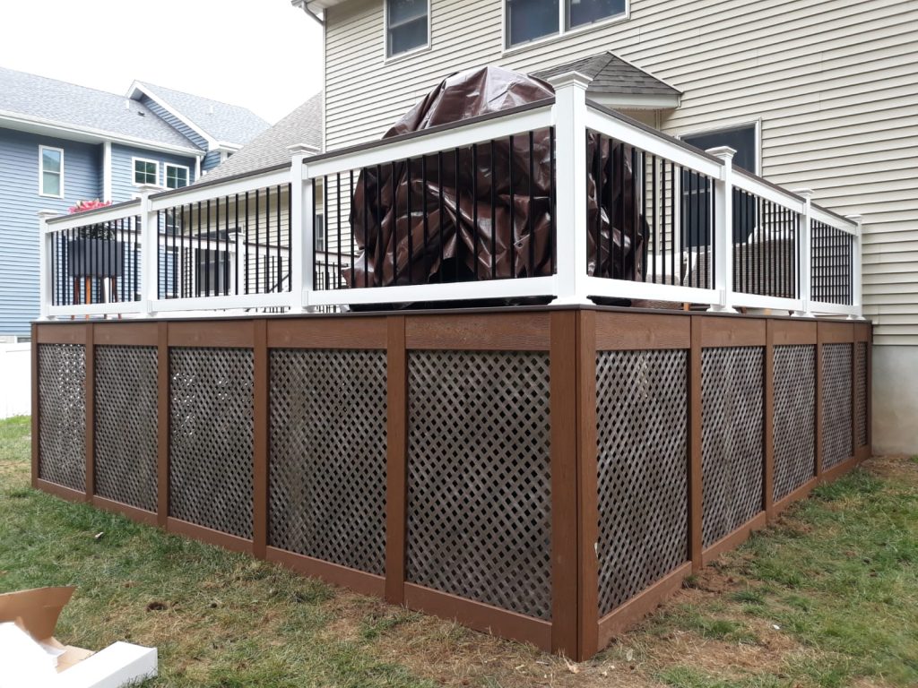 small deck with brown base and white railings